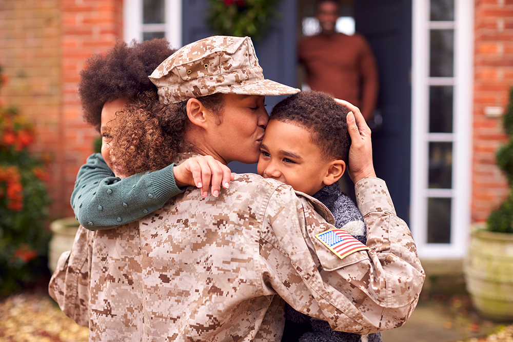 MILITARY FAMILY LAW - American Female Soldier In Uniform Returning Home To Family On Hugging Children Outside House